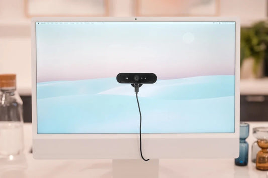 PlexiCam Mag2 magnetic mount holding a professional webcam