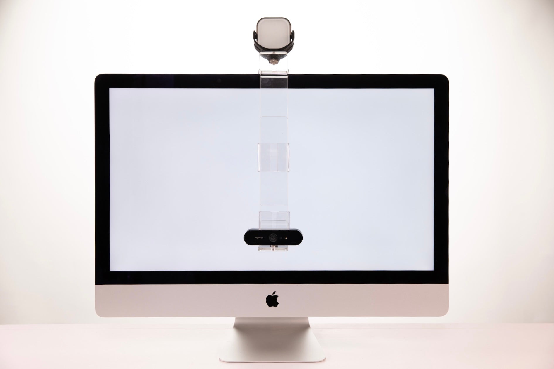 PlexiCam LED Light Kit attached to PlexiCam Pro with extension on 27 inch iMac